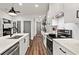 Modern kitchen with stainless steel appliances, stylish countertop, and hanging bicycle décor at 12 Becker Nw Pl, Atlanta, GA 30307