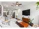 Bright living room featuring hardwood floors, sectional sofa, and an open floor plan at 12 Becker Nw Pl, Atlanta, GA 30307