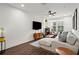 Bright and inviting living room featuring comfortable seating, hardwood floors, and large window at 12 Becker Nw Pl, Atlanta, GA 30307
