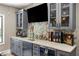 Wet bar featuring modern finishes, storage, tile backsplash, and a beverage fridge at 1270 Briarwood Ne Rd, Atlanta, GA 30319