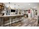 Basement bar with counter seating, pendant lighting, and beverage center at 1270 Briarwood Ne Rd, Atlanta, GA 30319