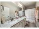 Well-lit bathroom with double vanity, granite countertop, and modern fixtures at 1270 Briarwood Ne Rd, Atlanta, GA 30319