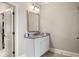 Well-lit bathroom vanity features ample storage space, a gray countertop, and modern fixtures at 1270 Briarwood Ne Rd, Atlanta, GA 30319