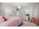 Bright bedroom with a comfortable bed, dresser, and unique decor at 1270 Briarwood Ne Rd, Atlanta, GA 30319