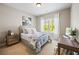 Comfortable bedroom with a plush bed, window with natural light, and a functional desk area at 1270 Briarwood Ne Rd, Atlanta, GA 30319