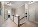Upstairs hallway with access to laundry room, bedrooms and full bathroom at 1270 Briarwood Ne Rd, Atlanta, GA 30319