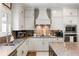 Bright kitchen with white cabinets, granite countertops, stainless steel appliances, and a large island at 1270 Briarwood Ne Rd, Atlanta, GA 30319