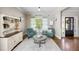 Cozy living room featuring hardwood floors, neutral paint, with accent chairs, and area rug at 1270 Briarwood Ne Rd, Atlanta, GA 30319