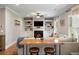 Comfortable living room with fireplace, built-in shelving, and large windows at 1270 Briarwood Ne Rd, Atlanta, GA 30319
