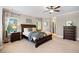 Bright main bedroom with a bed, dresser, ceiling fan, and natural light at 1270 Briarwood Ne Rd, Atlanta, GA 30319
