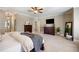 Spacious main bedroom featuring a TV, dresser, and natural lighting at 1270 Briarwood Ne Rd, Atlanta, GA 30319