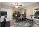 Home office featuring natural light, exercise equipment, and a modern desk at 1270 Briarwood Ne Rd, Atlanta, GA 30319