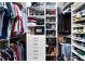 Walk-in closet with custom shelves, drawers and storage for clothes, hats, shoes and personal safe at 1270 Briarwood Ne Rd, Atlanta, GA 30319
