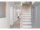Bright entryway with hardwood floors, a staircase, and neutral paint at 209 Chiswick Loop, Stockbridge, GA 30281