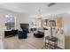Cozy living room featuring a fireplace, modern lighting, and a stylish seating area at 209 Chiswick Loop, Stockbridge, GA 30281