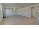 Spacious living room features wood-look floors, recessed lighting, and natural light from nearby windows at 209 Chiswick Loop, Stockbridge, GA 30281