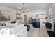 Open-concept living space with a modern kitchen, dining area, and a cozy living room at 209 Chiswick Loop, Stockbridge, GA 30281
