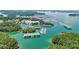 Scenic aerial view of a marina featuring boat docks, calm waters, and verdant trees at 3131 Lee Cir, Buford, GA 30518