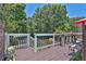 Elevated deck with wrought iron railings overlooks backyard, perfect for entertaining or relaxing at 3131 Lee Cir, Buford, GA 30518