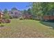 Beautiful backyard features a deck, patio, privacy fence, and well-maintained landscaping at 3131 Lee Cir, Buford, GA 30518