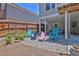 Backyard fire pit area with colorful Adirondack chairs, ideal for outdoor gatherings at 3131 Lee Cir, Buford, GA 30518