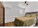 Bedroom features wood floors, a comfy bed, and natural lighting at 3131 Lee Cir, Buford, GA 30518