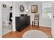 Bedroom featuring hardwood floors, a dresser, and an adjacent bathroom at 3131 Lee Cir, Buford, GA 30518