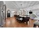 Open-concept dining area with hardwood floors and decorative ceiling is perfect for entertaining guests at 3131 Lee Cir, Buford, GA 30518