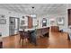 Inviting dining room with hardwood floors, stainless steel appliances, and natural light from window at 3131 Lee Cir, Buford, GA 30518