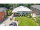 Overhead shot showcasing front yard, mature trees, and manicured landscape with a homey facade at 3131 Lee Cir, Buford, GA 30518
