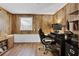 Comfortable home office space with wood paneled walls and a modern computer setup at 3131 Lee Cir, Buford, GA 30518
