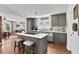 The eat-in kitchen features grey cabinets, a large island with bar seating, and stainless steel appliances at 3131 Lee Cir, Buford, GA 30518