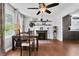 Living room features a ceiling fan, hardwood flooring, fireplace, and stylish furnishings at 3131 Lee Cir, Buford, GA 30518