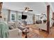 Inviting living room featuring hardwood floors, French doors, neutral decor, and a ceiling fan at 3131 Lee Cir, Buford, GA 30518
