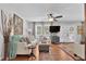 Comfortable living room boasts hardwood floors, neutral decor, French doors, and a ceiling fan at 3131 Lee Cir, Buford, GA 30518