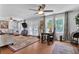 Comfortable living room features a ceiling fan, hardwood flooring, and French doors to the deck at 3131 Lee Cir, Buford, GA 30518