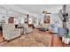 Bright living room with hardwood floors, neutral furniture, ceiling fan, and an open layout at 3131 Lee Cir, Buford, GA 30518