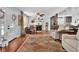 Open living space with a small fireplace, hardwood flooring, and lots of natural light at 3131 Lee Cir, Buford, GA 30518