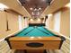 Finished basement with a pool table, creating a perfect entertainment space at 5157 Wellisford Ct, Suwanee, GA 30024