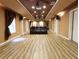 Large basement with wood floors, home theater setup, and ample space at 5157 Wellisford Ct, Suwanee, GA 30024