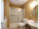 Cozy bathroom featuring a tub, sink, and toilet, perfect for a quick refresh at 5157 Wellisford Ct, Suwanee, GA 30024