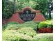 Grandview The Glen community sign surrounded by lush landscaping and colorful plants at 5157 Wellisford Ct, Suwanee, GA 30024