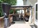 Outdoor deck furnished with comfortable seating and gazebo at 5157 Wellisford Ct, Suwanee, GA 30024