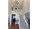 Grand foyer with high ceilings, a staircase, and hardwood flooring at 5157 Wellisford Ct, Suwanee, GA 30024