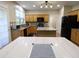 Modern kitchen with wood cabinets, granite counters, and stainless appliances at 5157 Wellisford Ct, Suwanee, GA 30024