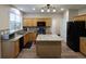 Bright kitchen featuring wooden cabinets, granite countertops, and stainless steel appliances at 5157 Wellisford Ct, Suwanee, GA 30024