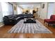 Open-concept living room with a fireplace, and comfortable seating at 5157 Wellisford Ct, Suwanee, GA 30024