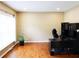 Bright office space featuring a large desk, hardwood floors, and a window with natural light at 5157 Wellisford Ct, Suwanee, GA 30024