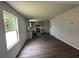 Open floor plan combining kitchen and living room, featuring hardwood floors and bright lighting at 15 Fontana Ct, Covington, GA 30016