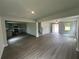 Open concept living room with a view into the kitchen and entry way at 15 Fontana Ct, Covington, GA 30016